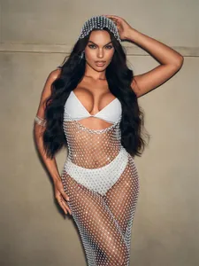 Close-up detail of a sparkling silver rhinestone fishnet cover-up dress for beachwear