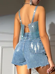 Close-up detail of sparkling rhinestone fishnet camisole with sexy open back design