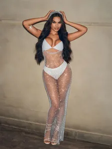 Sexy sparkling fishnet bikini cover-up dress with rhinestone detailing on a model