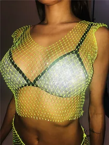 Detail of sexy neon green rhinestone fishnet crop top for nightclub parties