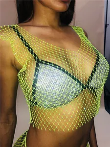 Detailed view of sexy lime green fishnet crop top featuring sparkling crystal rhinestones