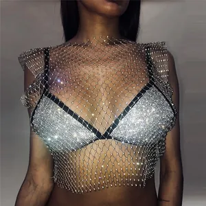 Close-up detail of a sexy silver rhinestone mesh fishnet top for night club parties