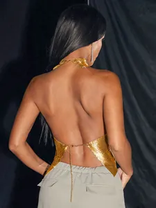 Detailed back view of gold metallic mesh halter top with backless chain design.