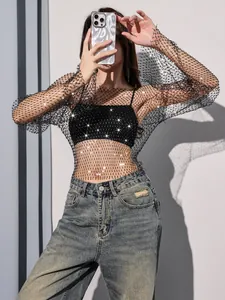 Detailed view of women's black sheer mesh long sleeve top with shimmering rhinestones