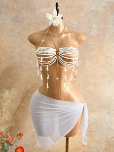 Elegant white pearl beaded body chain and halter bra displayed on a mannequin.