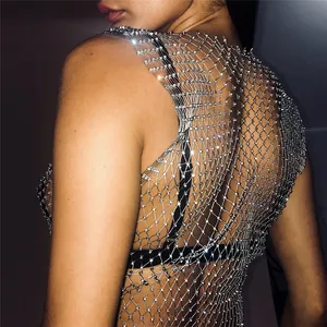 Detailed macro view of a sparkling rhinestone fishnet mesh tank top for sexy nightclub wear