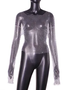 Close-up of white rhinestone fishnet top featuring intricate hollow-out mesh design