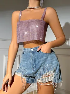 Detail view of a shimmering pink rhinestone mesh crop top perfect for clubwear or parties