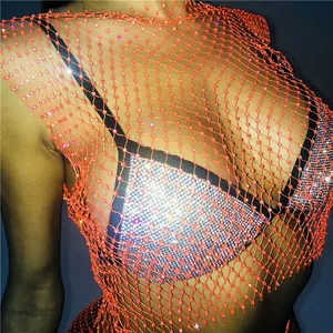 Detailed view of a sexy orange fishnet top with sparkly rhinestones, perfect for clubwear fashion