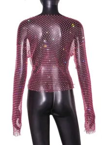 Close-up detail of sexy pink rhinestone fishnet mesh long sleeve top for women
