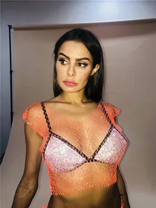 Detail view of sexy orange fishnet tank top with sparkling rhinestones for nightclub wear