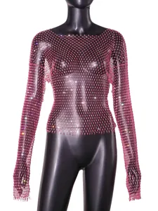 Close-up of pink fishnet top with rhinestones showing mesh detail and sparkle