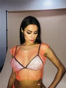 Detail view of sexy orange fishnet top with sparkling rhinestones for parties