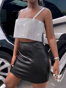 Detailed view showing the sparkly silver rhinestone mesh camisole top and leather skirt