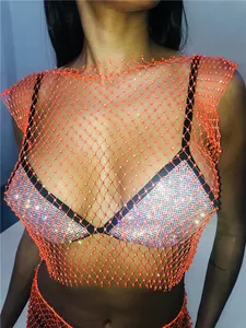 Detailed view of sexy orange fishnet rhinestone crop top for nightclub and party wear