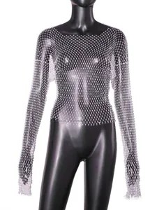 Close-up detail of sexy sparkling rhinestone fishnet long sleeve top for women