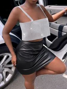 Close-up of sparkling rhinestone mesh camisole top for glamorous evening wear