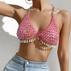 Close-up detail of pink bead halter top with pearl tassels for nightclub parties.