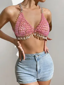 Detailed view of a sexy pink gemstone halter top featuring elegant white pearl drop accents.