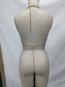 Back view detail of gold halter body chain on mannequin for beach bikini style