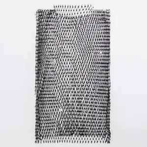 Macro detail showing the texture of black fishnet camisole top with sparkling rhinestones