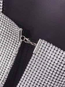 Close-up detail of sexy silver rhinestone mesh vest with lobster clasp