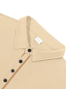 Macro view of men's polo shirt collar showing fabric texture and button placket