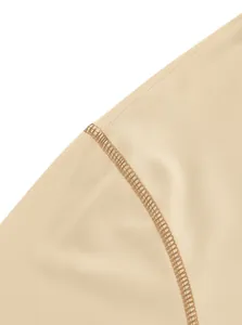 Close-up detail of high-quality reinforced stitching on a beige cotton men's Polo shirt