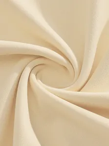 High-quality close-up of soft beige knit fabric texture for men's casual polo shirt