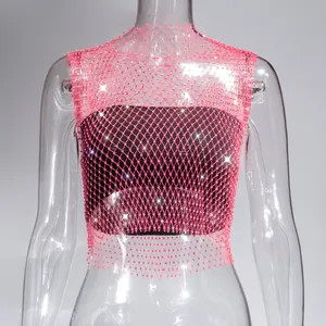 Close-up of pink fishnet mesh crop top with sparkling rhinestone embellishments