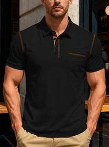 Close-up of black men's Polo shirt featuring orange contrast stitching and chest pocket detail