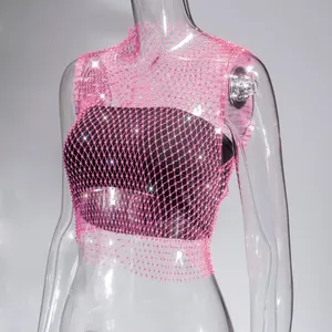 Close-up of pink fishnet mesh top with sparkling rhinestone details