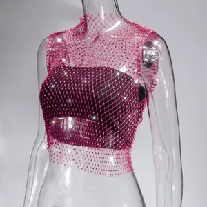 Close-up detail of sexy pink rhinestone fishnet tank top with sparkling crystals on mesh fabric