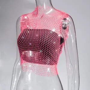 Detailed view of pink fishnet mesh crop top embellished with sparkling rhinestones
