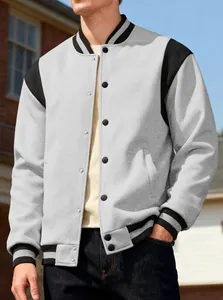 Close-up detail of men's grey and black color block varsity jacket with snap buttons