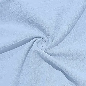 Close-up macro view showing the breathable cotton linen fabric texture in light blue color