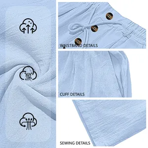 Detailed macro view of light blue men's linen pants fabric, waistband, and sewing.