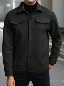 Detailed shot of a men's dark grey wool-blend jacket with lapel collar and flap pockets