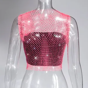 Detailed macro shot of a sexy pink rhinestone fishnet mesh crop top for nightlife