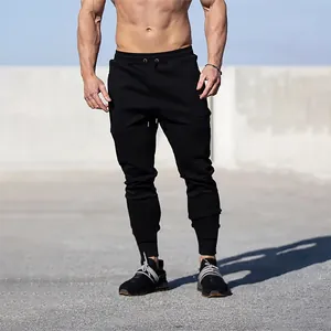 Pantaloni sportivi neri da uomo con coulisse e polsini a coste per fitness e corsa.