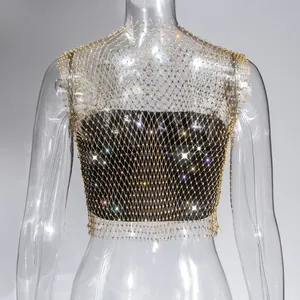 Detailed view of the sparkling rhinestone gold mesh top with a sexy hollow fishnet design