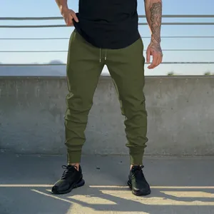 Full-length view of olive green men's athletic joggers with drawstring and ribbed cuffs