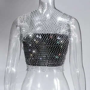 Close-up of a sparkly silver rhinestone mesh fishnet crop top for nightclub wear.