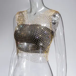 Detailed macro shot of a sexy gold rhinestone mesh fishnet vest for night clubwear
