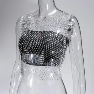 Macro detail showing the intricate sparkling rhinestones on a silver fishnet mesh top