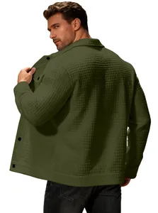 Detailed view of green waffle-knit jacket texture on male model's back profile