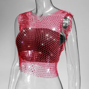 Close-up detail of sexy red fishnet mesh tank top decorated with shimmering rhinestones