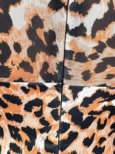 Close-up of leopard print mesh and stretch fabric details on a sexy women's jumpsuit.