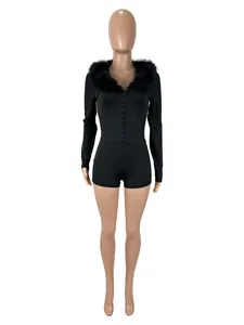 Detailed macro view of women's black long-sleeve slim fit jumpsuit with a faux fur collar