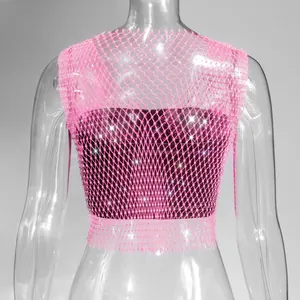 Detailed macro view of pink fishnet rhinestone tank top showing sparkly crystal accents